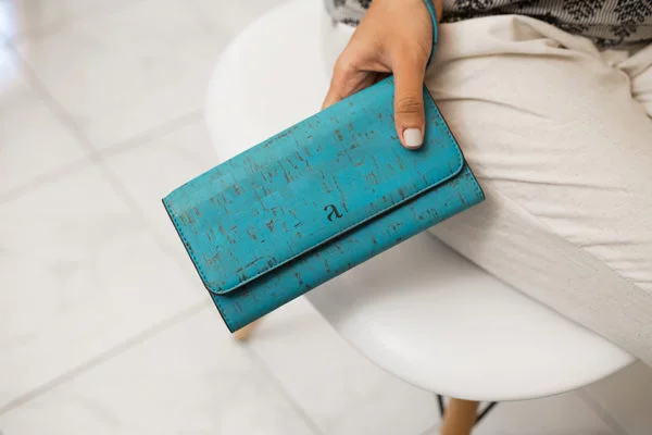 Ela Trifold Wallet Teal Hand