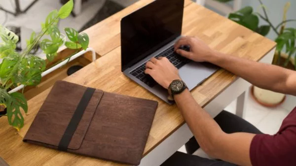 Skye Mac Laptop Sleeve Brown Hand Desk