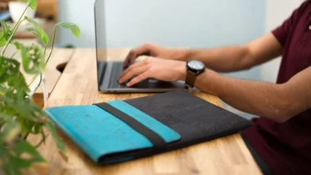 Skye Mac Laptop Sleeve Teal Black Desk