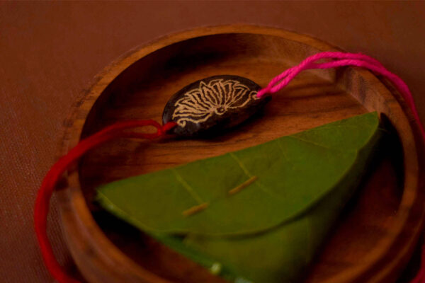 Magenta Lotus seed rakhi with plantable seeds